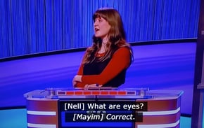 Screenshot of jeopardy contestant answering a question correctly. Subtitles say Nell- What are eyes? Mayim- Correct.