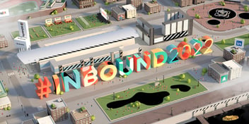 Screenshot from the INBOUND 2022 digital conference area. A 3D cityscape surrounds colorful letters that say #INBOUND2022.