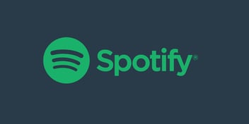 Green Spotify logo on a dark blue background.